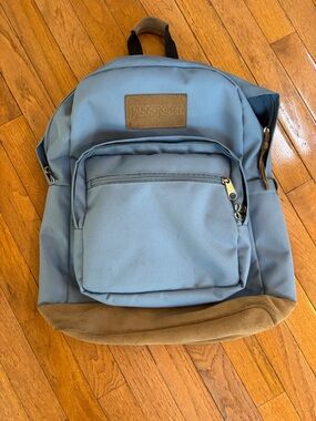 Jansport Light Blue Backpack with Brown Suede Base